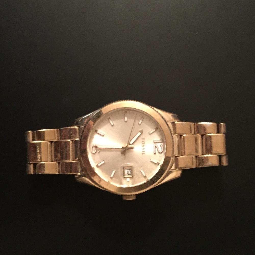 Women’s gold fossil watch